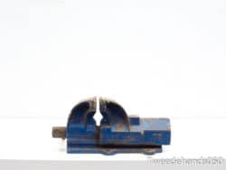 Vintage blue vise with authentic wear, perfect for woodworking and metalworking projects.