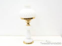 Elegant white vintage lamp with gold accents and swirling texture for stylish home decor.