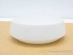 Elegant glossy white bowl with a modern minimalist design for stylish serving and decor.