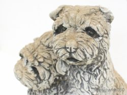 Stylized dog sculpture capturing friendship and loyalty, ideal for home or garden decor.