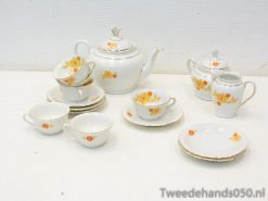 Elegant floral porcelain tea set with gold accents, ideal for afternoon tea gatherings.