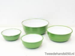 Vintage green bowls with glossy white interiors, ideal for mixing, serving, and nostalgic kitchen decor.