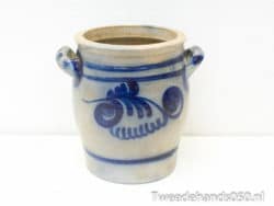 Elegant beige ceramic pot with blue patterns, perfect for decor or plant display.