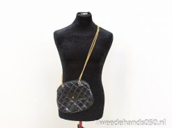 Chic black quilted handbag with gold chain strap, perfect for any stylish occasion.