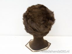 Luxurious dark brown faux fur hat for elegant winter style and versatile occasions.