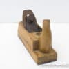 Vintage wooden hand plane for woodworking, showcasing craftsmanship and traditional design.