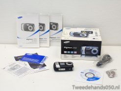 Vintage Samsung Digimax A502 camera with manuals and accessories, ideal for photography collectors.