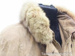 Chic vintage tan leather jacket with a luxurious fur collar for stylish winter warmth.