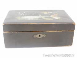 Charming vintage black wooden box with floral design; perfect for decor or treasured storage.