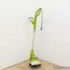 Sleek green electric weed trimmer for efficient lawn care and easy garden maintenance.