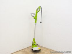 Sleek green electric weed trimmer for efficient lawn care and easy garden maintenance.