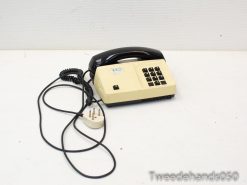 Beige and black vintage telephone, perfect for adding nostalgic charm to your decor.