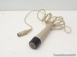 Classic beige handheld microphone with coiled cable, perfect for vintage audio collectors.