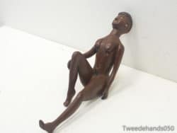 Elegant wooden female sculpture in a serene pose, ideal for modern decor and tranquility.