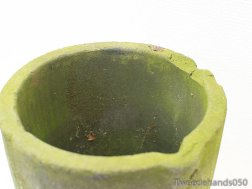 Weathered green planter with character, ideal for enhancing gardens and home decor.