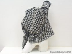 Elegant houndstooth fabric sculpture showcasing the fusion of fashion and artistic creativity.