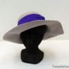 Elegant gray wide-brimmed hat with purple band, ideal for both casual and formal occasions.