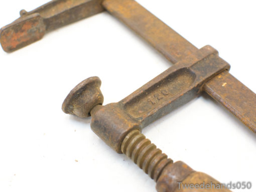 Rusty vintage C-clamp: durable woodworking tool with history, perfect for collectors and enthusiasts.