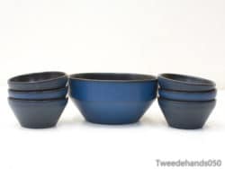 Elegant deep blue ceramic bowl set for stylish dining and versatile home decor.