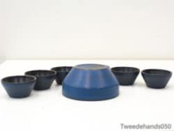 Stylish deep blue and black ceramic bowl set for elegant dining and shared meals.