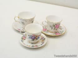 Elegant floral porcelain tea cups with gold accents for vintage tea parties and decor.