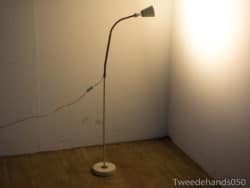 Sleek modern floor lamp with warm glow, perfect for cozy contemporary interiors.