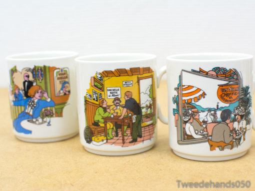 Vintage mugs featuring colorful café scenes of friendship and joyful coffee moments.