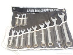 12-piece ring and open-end wrench set in organized black pouch for versatile use.