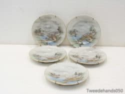 Elegant vintage porcelain plates with serene landscapes, perfect for decor and special occasions.