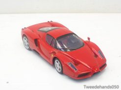 Vibrant red Ferrari Enzo miniature model, perfect for collectors and car enthusiasts alike.