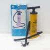 Powerful yellow double-action pump for quick inflation of various outdoor items and sports gear.