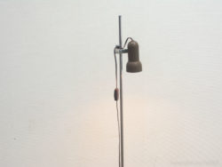 Sleek minimalist floor lamp with retro charm, ideal for modern interiors and focused lighting.