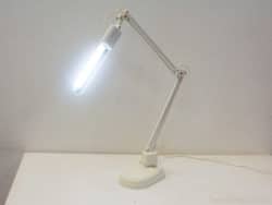 Sleek white LED desk lamp with adjustable arms for versatile and stylish workspace lighting.