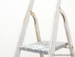 Weathered step ladder showcasing rustic charm and durability for home projects and vintage decor.