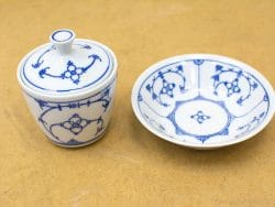 Elegant blue and white porcelain set with floral designs, ideal for dining and decor.