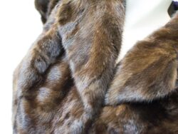 Luxurious deep brown fur coat with rich texture and elegant shine for stylish women.