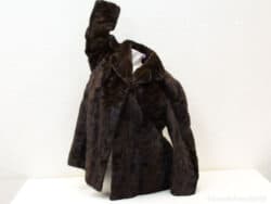 Luxurious vintage dark brown faux fur coat for stylish warmth on cold winter days.