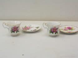 Elegant vintage porcelain tea set with pink floral design, ideal for afternoon tea and decor.