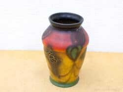 Vibrant vintage vase with abstract designs, perfect for enhancing decor and floral arrangements.