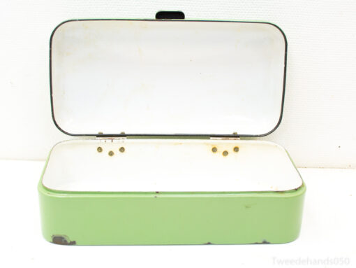 Vintage green metal box with white interior and brass details for stylish storage solutions.