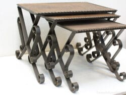 Chic wooden and metal nesting tables, combining rustic charm and versatile design for any decor.