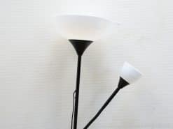 Sleek modern floor lamp with black metal base and dual frosted shades for stylish lighting.