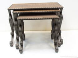 Chic vintage nesting tables in wood and metal, adding style and functionality to any space.