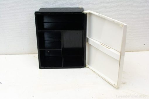 Stylish black and white storage box with compartments for organizing craft and office supplies.