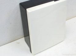 Modern black and white storage box with glossy finish for elegant organization in any space.