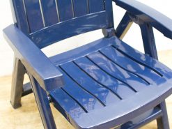 Elegant navy blue Adirondack chair with slats, perfect for stylish comfort indoors and outdoors.