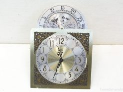 Chic vintage dual-faced clock with ornate design and playful monthly dial in silver.