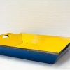 Charming blue and yellow retro serving tray with handles, ideal for snacks or decoration.