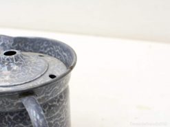 Rustic vintage metal pot with gray marbled finish, ideal for decor and culinary use.