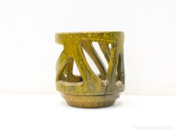 Handcrafted olive green ceramic pot with cutouts, ideal for decorative and planting uses.